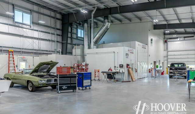 interior shot of completed body shop garage with cement floors and steel beam ceilings