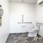 interior shot of completed white bathroom with marble floors
