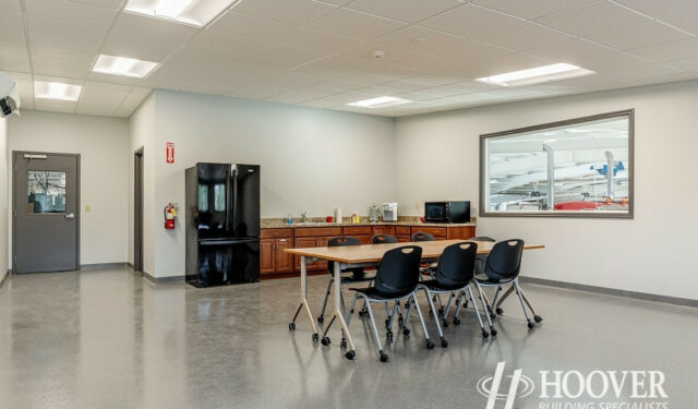 interior shot of risser poultry break room with fridge and cement floors