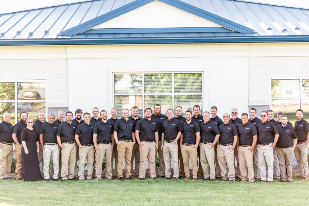 The team in front of the office building