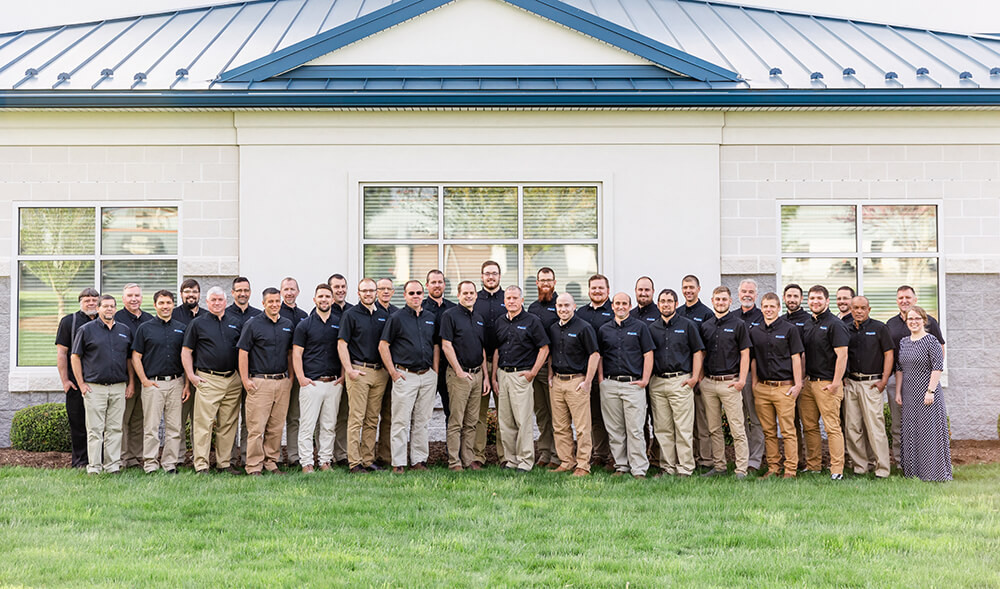 The team in front of the office building