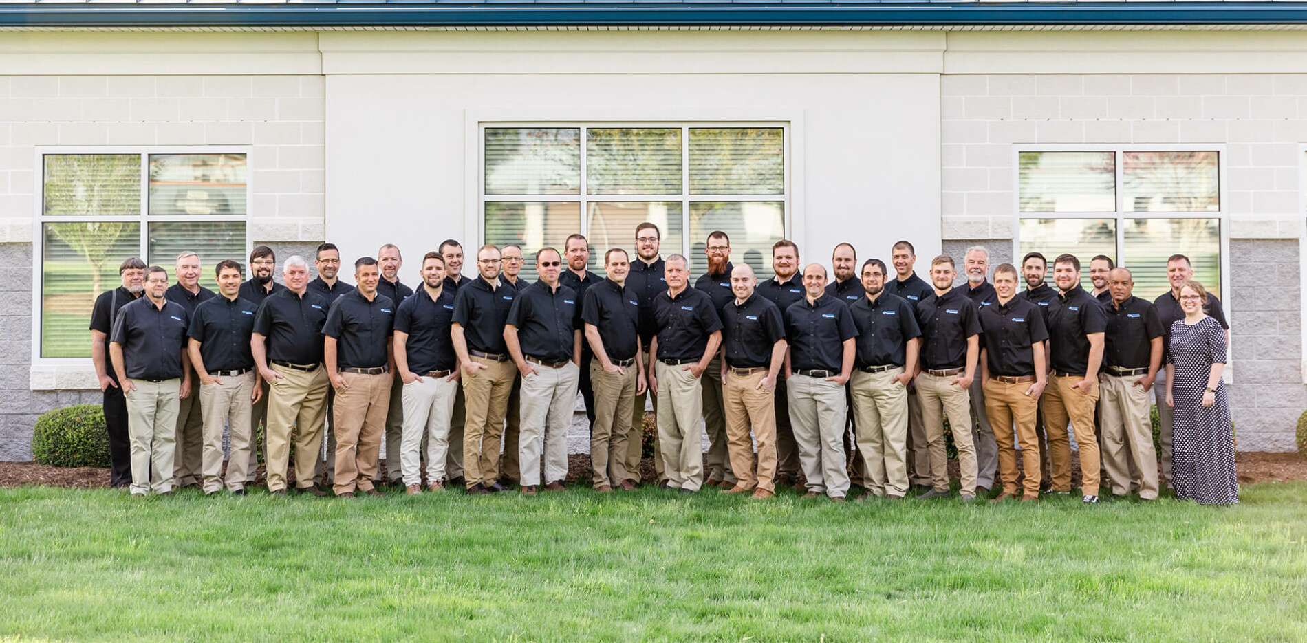 The team in front of the office building