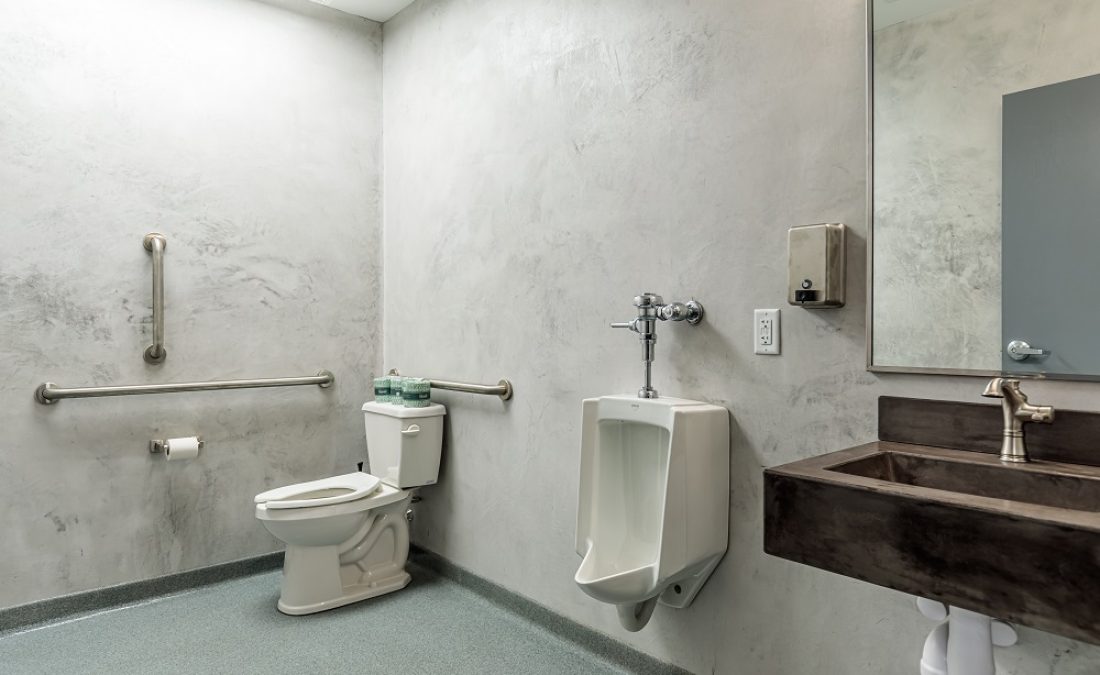 newly designed office bathroom with gray walls
