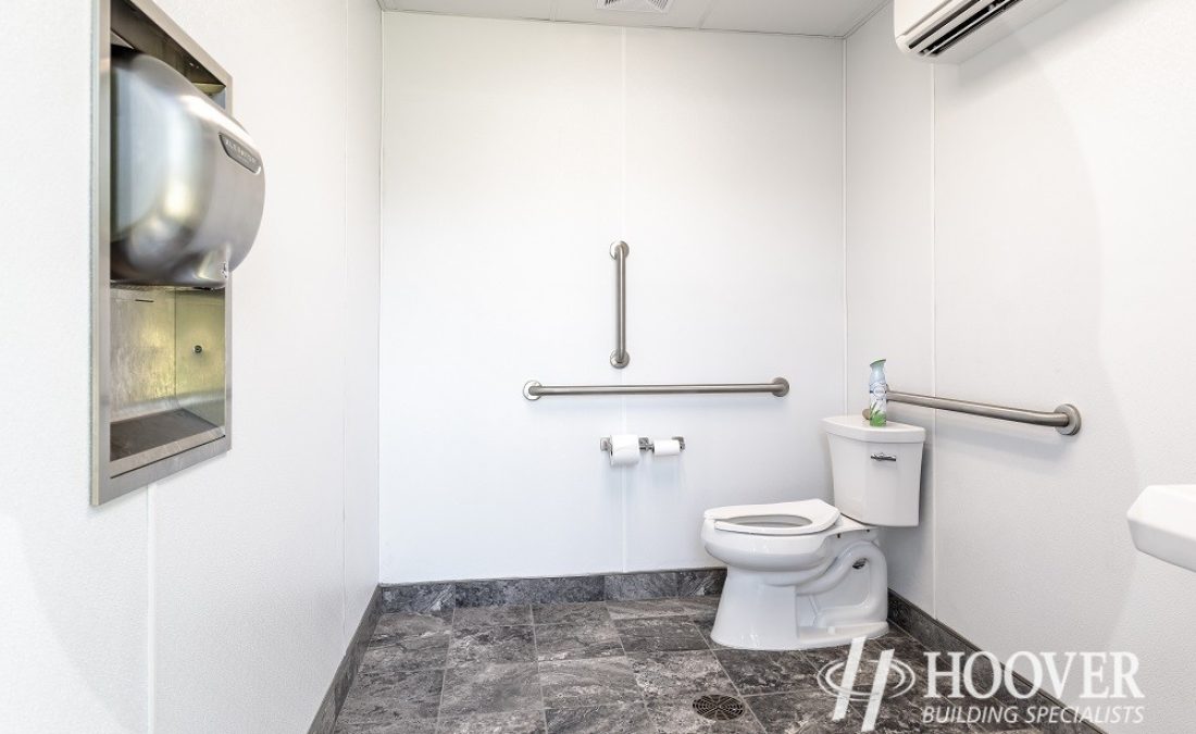 interior shot of completed white bathroom with marble floors