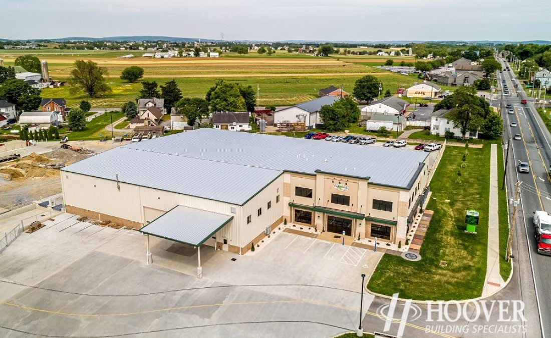 aerial view of metal roof on new office space and attached warehouse
