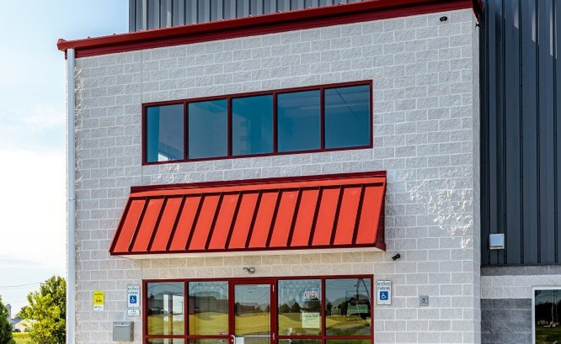close up of red steel awning with black trimmings