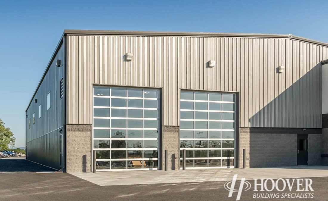 tan metal steel building with clear glass windows